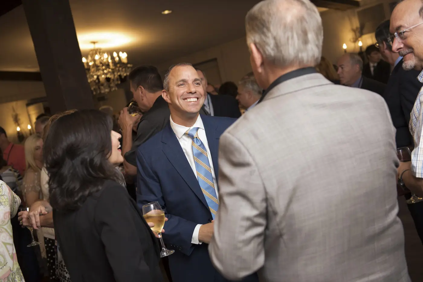 Dan Barram with clients at an event